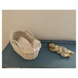 SLEEPING BABY WITH GOLD PAINTED DETAIL IN BASKET