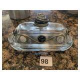 COVERED BUTTER W/ METAL WRAP AND COLORED STONES