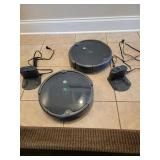 TWO ROOMBA ROBOT VACUUMS WITH CHARGING CRADLES