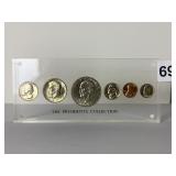 COIN SET IN LUCITE HOLDER