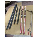 MULTIPLE PAIRS OF SKIS AND ONE SET OF POLES