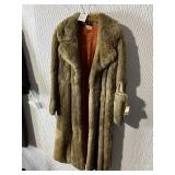 FUR COAT DOES HAVE PELT DAMAGE ON LEFT SLEEVE