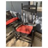 2 BLACK WOODEN ROCKING CHAIRS WITH RED CUSHIONS