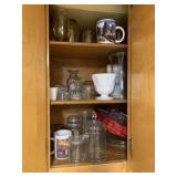 CABINET W/ MUGS, AMBER GLASSES, GLASS TOP JARS