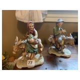 FIGURINES OF MAN AND WOMAN ON DONKEYS, 8" TALL