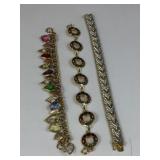 CINER GOLD TONE AND RHINESTONE BRACELET HEART