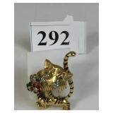 JOMAZ GOLD TONE TIGER PIN HOLDING FLOWERS WITH