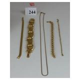 FOUR MONET GOLD TONE BRACELETS AND ONE CHAIN