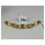 HATTIE CARNEGIE GOLD TONE AND RHINESTONE BRACELET