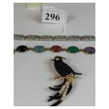 BLACK AND GOLD WITH RHINESTONES BIRD OF PARADISE