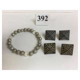 SILVER TONE ELASTICIZED BRACELET AND TWO PAIRS OF