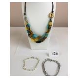 POLISHED STONE TRIPLE STRAND NECKLACE ON CORDING