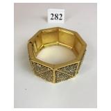 GOLD TONE YVES ST LAURENT RHINESTONE BRACELET