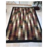 MULTICOLORED RUG, 62" X 96" IN GOOD CONDITION