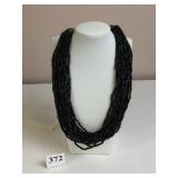 MULTI STRAND BLACK SLANT CUT BEADED NECKLACE