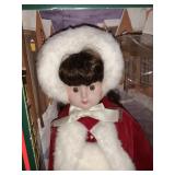 PORCELAIN HOLIDAY DOLL, FROM 1989. 17" TALL IN