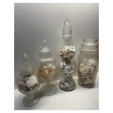 GLASS JARS FULL OF SHELLS