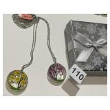 2 INCASED FLOWER ROUND PENDANT WITH SILVER TONE