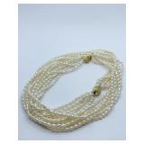 6 STRANDS OF MAN-MADE PEARLS