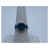 BLUE SWISS TOPAZ RING W/ SQUARE CENTER STONE AND