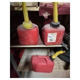 THREE GAS CANS .