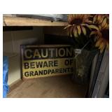 CAUTION SIGN AND SUNFLOWERS