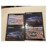 4 NEW IN BOX PUZZLES BY NOVAKOWSKI 12X18