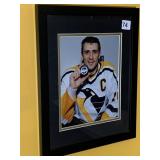 PENS FRAMED PICTURE 12X16 HOLDING PUCK