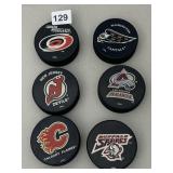 6 HOCKEY PUCKS