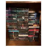 STACKS OF PAPER BACK FICTION BY SHARON SALA,