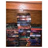 STACKS OF PAPER BACK FICTION BY KERI ARTHUR,