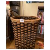 TALL WOVEN BASKET WITH LEATHER HANDLES