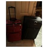 TWO SUITCASES W/ HANDLE AND 1 WITH 4 WAY REAR