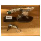 STAG HANDLE KNIFE WITH SHEATH ON LOG DISPLAY