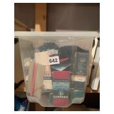 SMALL STORAGE TUB FILLED TO THE BRIM WITH NEW AND