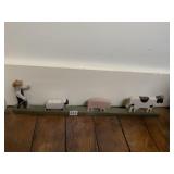 FARMER CORRALLING ANIMALS