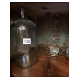 2 GREEN BOTTLES AND SPRING CENTER CANDLE HOLDERS