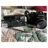 NIKON CAMERA, BENT LENSE AS SHOWN, FUJI CAMERA,