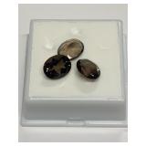 THREE OVAL BROWN STONES 1.41 GRAMS 10X8MM