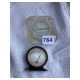 THE LINCOLN OIL GAUGE AND THE GRISWOLD ASH TRAY