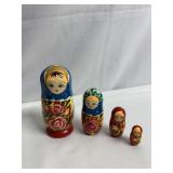 4 PC. NESTER SET HAND PAINTED