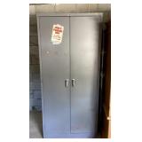 2 DOOR METAL CABINET WITH SHELVES INSIDE. NO