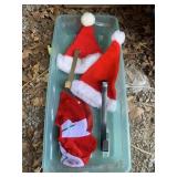 PLASTIC TOTE WITH SANTA HATS, DOOR HANGERS, ETC.
