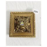 FLOWER PAINTING .5" IN CENTER OF ORNATE BOARDER