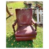 RED LEATHER ARMCHAIR WITH CARVED WOOD GOOSENECK