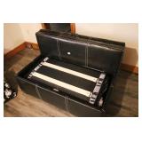 BLACK OTTOMAN THAT FOLDS OUT TO A TWIN BED