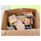 BOX OF WOODEN ROSETTES AND CAULKING