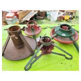 FOUR VINTAGE CHRISTMAS TREE STANDS.