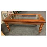 WOODEN COFFEE TABLE ON CASTERS BEVELED GLASS 48 W