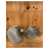 TWO SLANT FRONT GLASS STORAGE JARS